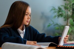 medium shot girl learning math school (1)