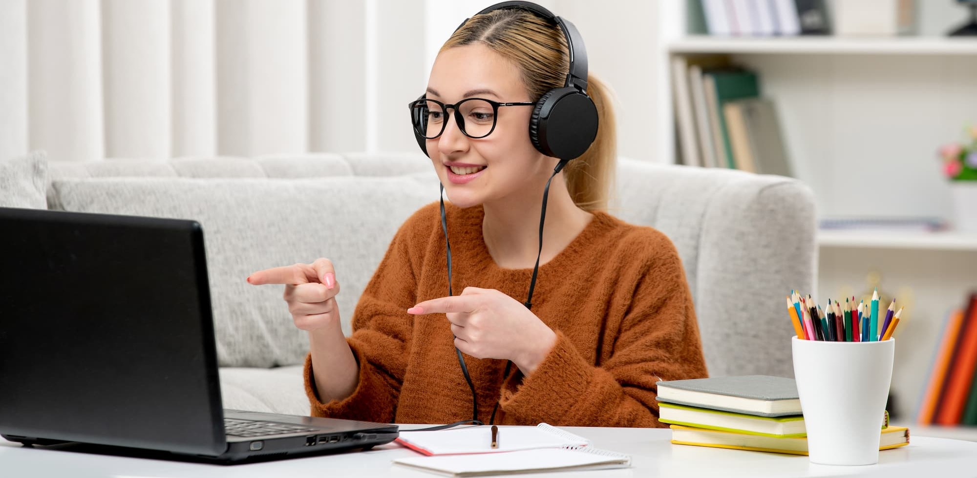 student online cute girl glasses sweater studying computer smiling (1) (1)