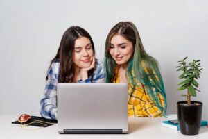 young student girls with laptop studying together (1)