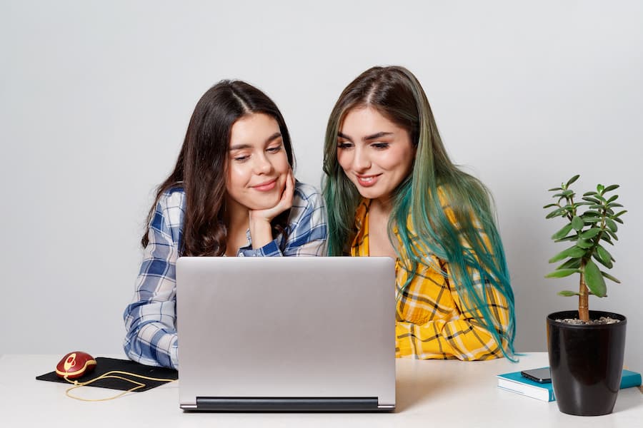 young student girls with laptop studying together (1)
